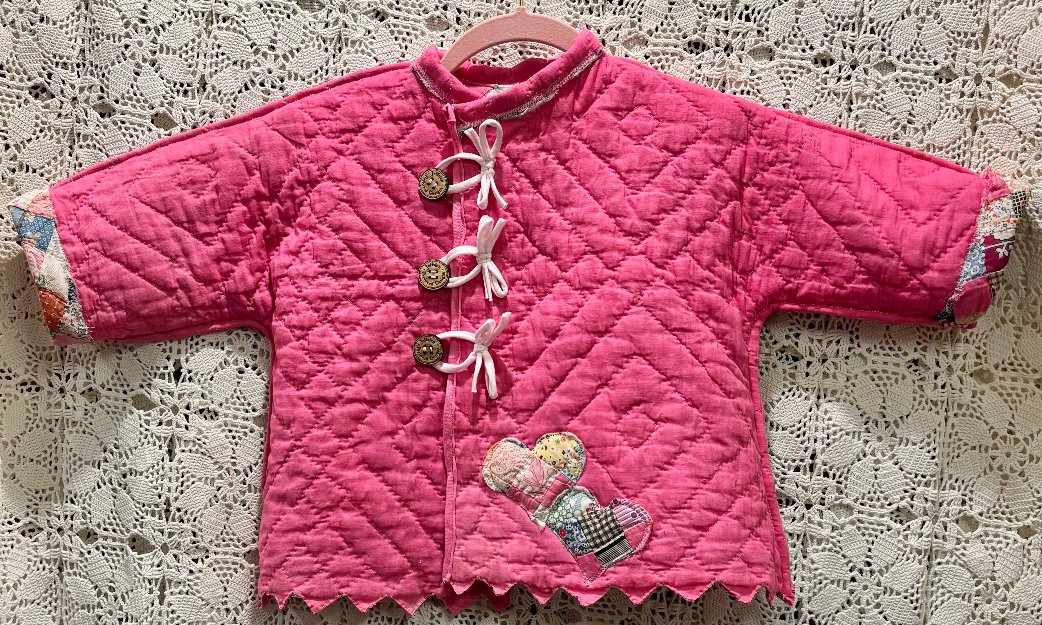 Abrigo de bebé reversible con pajarita